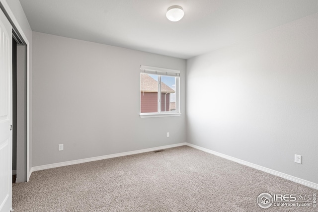 848 Shirttail Peak Dr, Windsor, CO 80550 - spare room featuring carpet and baseboards