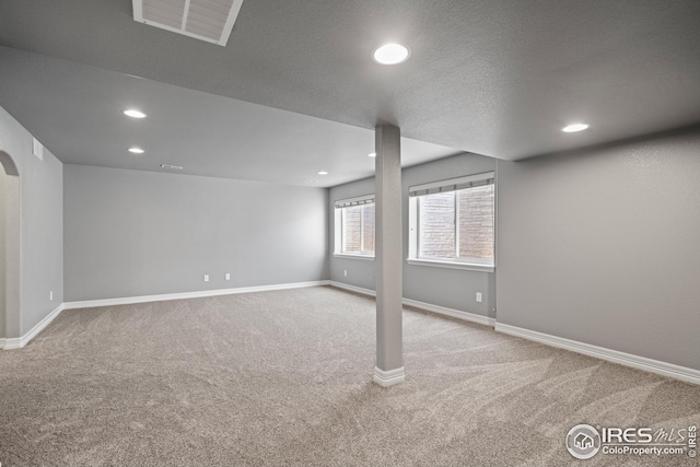 848 Shirttail Peak Dr, Windsor, CO 80550 - below grade area featuring carpet floors, recessed lighting, baseboards, and arched walkways