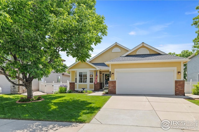 1427 Reeves Dr, Fort Collins, CO 80526 - view of front of home featuring brick siding, a garage, driveway, and a shingled roof