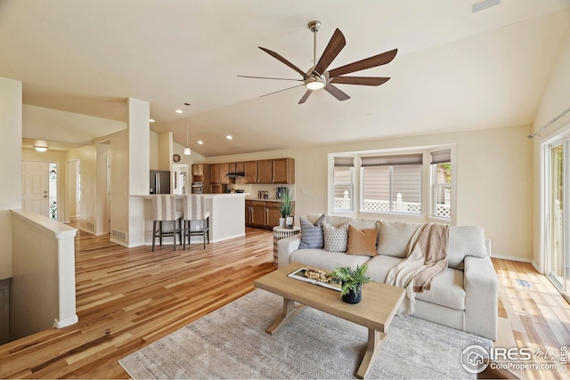 1427 Reeves Dr, Fort Collins, CO 80526 - living area featuring lofted ceiling, ceiling fan, light wood-style floors, recessed lighting, and baseboards