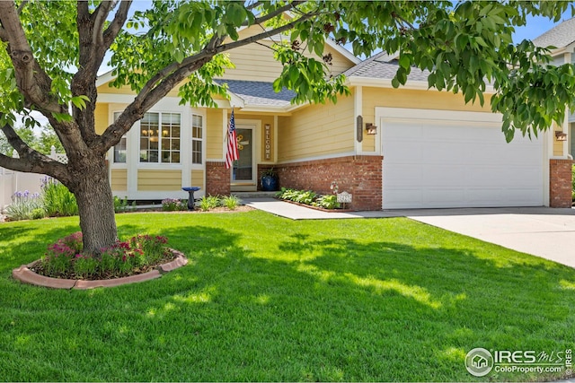1427 Reeves Dr, Fort Collins, CO 80526 - view of front of property featuring brick siding, a garage, roof with shingles, a front lawn, and concrete driveway