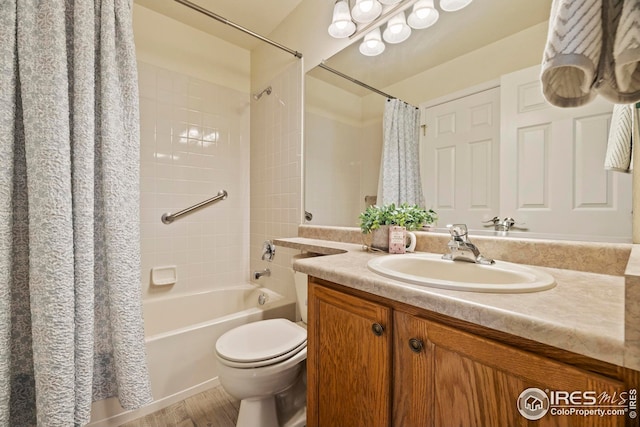 1427 Reeves Dr, Fort Collins, CO 80526 - full bath featuring shower / tub combo, vanity, toilet, and wood finished floors