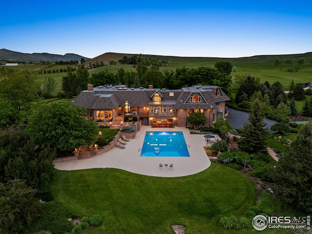 8000 N 41st St, Longmont, CO 80503 - swimming pool with a patio area, a yard, and a mountain view