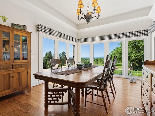 8000 N 41st St, Longmont, CO 80503 - dining room with a chandelier and light wood-style floors