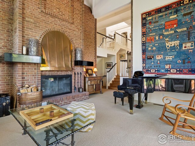8000 N 41st St, Longmont, CO 80503 - living area featuring a high ceiling, carpet, stairs, and a fireplace