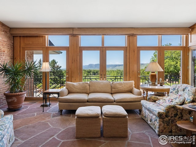 8000 N 41st St, Longmont, CO 80503 - living room with stone floors, a mountain view, and french doors