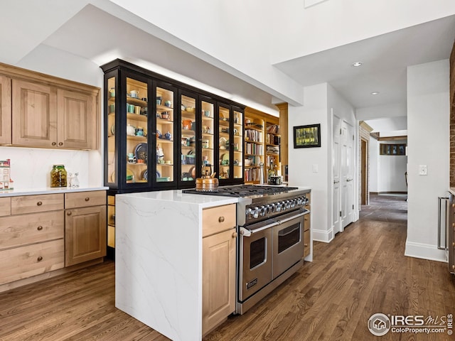 8000 N 41st St, Longmont, CO 80503 - kitchen with double oven range, dark wood-style floors, light brown cabinetry, light stone countertops, and recessed lighting