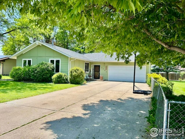1722 Pheasant Rdg, Sterling, CO 80751 - single story home featuring board and batten siding, a garage, and concrete driveway