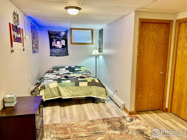 1722 Pheasant Rdg, Sterling, CO 80751 - bedroom with baseboard heating and wood finished floors