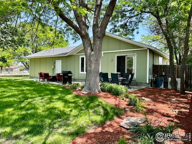 1722 Pheasant Rdg, Sterling, CO 80751 - rear view of property featuring board and batten siding and a patio area