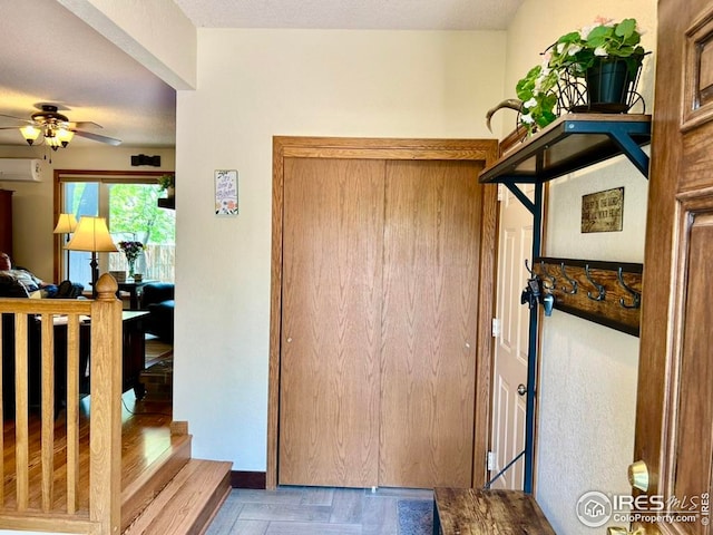 1722 Pheasant Rdg, Sterling, CO 80751 - foyer with a wall mounted air conditioner and a ceiling fan