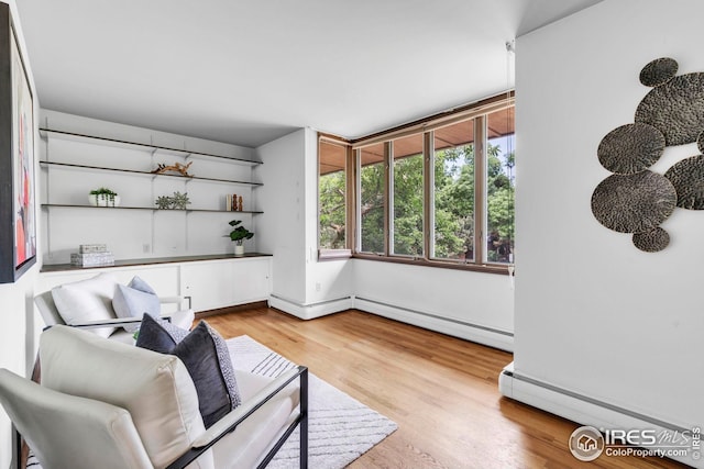 525 13th St, Boulder, CO 80302 - living area featuring wood finished floors and baseboard heating