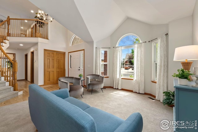 3514 Copper Spring Dr, Fort Collins, CO 80528 - living area featuring stairway, light carpet, a chandelier, recessed lighting, and high vaulted ceiling