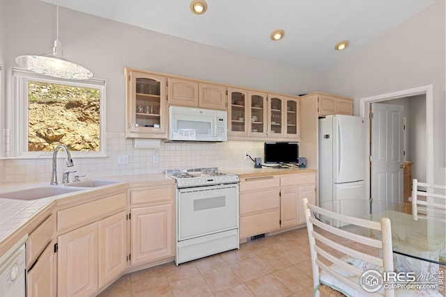 606 Sugarloaf Mountain Rd, Boulder, CO 80302 - kitchen featuring white appliances, tile countertops, light brown cabinets, and decorative backsplash