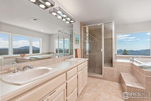 606 Sugarloaf Mountain Rd, Boulder, CO 80302 - full bath with a mountain view, tile patterned flooring, a garden tub, and a shower stall