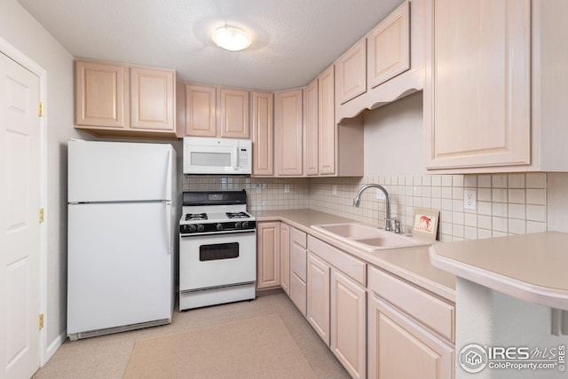 606 Sugarloaf Mountain Rd, Boulder, CO 80302 - kitchen featuring white appliances, light brown cabinetry, light countertops, backsplash, and a textured ceiling