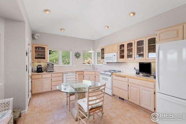 606 Sugarloaf Mountain Rd, Boulder, CO 80302 - kitchen with white appliances, light brown cabinets, backsplash, glass insert cabinets, and recessed lighting