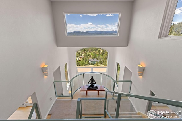 606 Sugarloaf Mountain Rd, Boulder, CO 80302 - staircase with a towering ceiling and baseboards