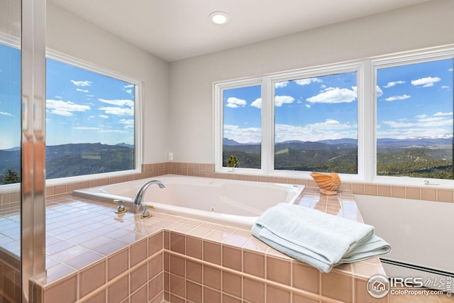 606 Sugarloaf Mountain Rd, Boulder, CO 80302 - full bath with plenty of natural light, a jetted tub, a mountain view, recessed lighting, and baseboard heating