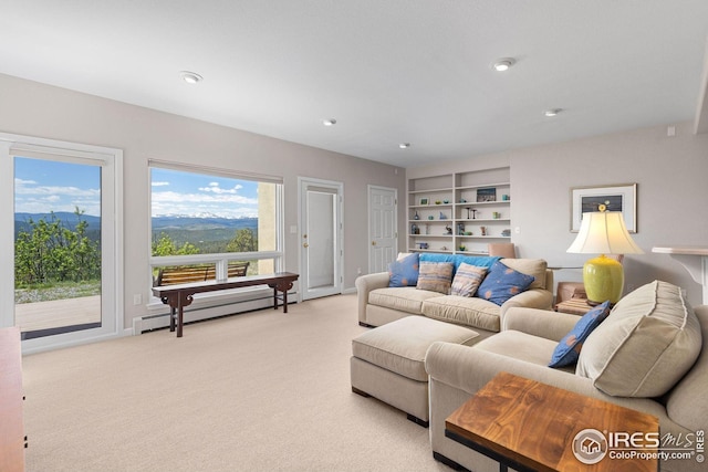 606 Sugarloaf Mountain Rd, Boulder, CO 80302 - living room featuring a baseboard heating unit, light carpet, recessed lighting, and built in shelves