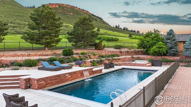1570 County Road 37e, Lyons, CO 80540 - view of pool featuring a mountain view, a fenced backyard, and a patio