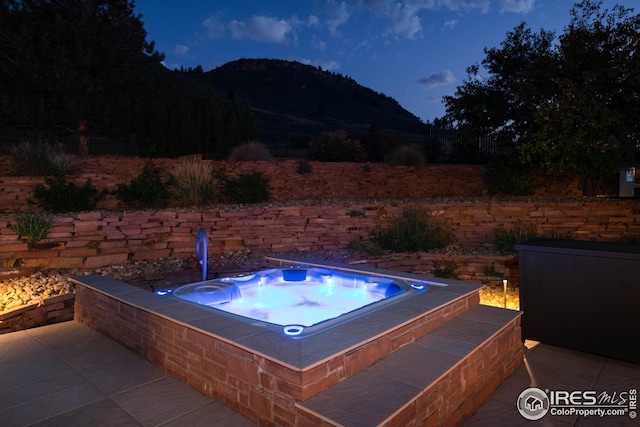 1570 County Road 37e, Lyons, CO 80540 - view of patio with a mountain view and an in-ground hot tub