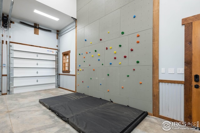 1570 County Road 37e, Lyons, CO 80540 - bedroom with concrete floors and a garage