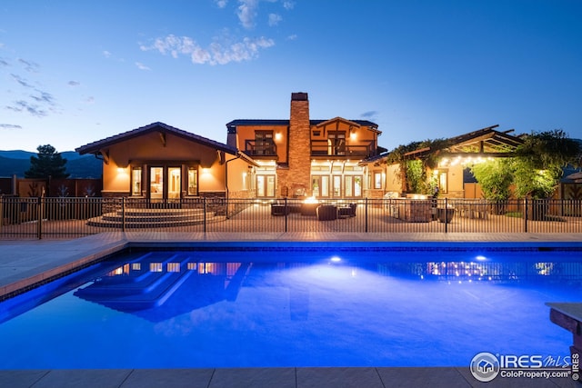 1570 County Road 37e, Lyons, CO 80540 - view of swimming pool with a patio and french doors