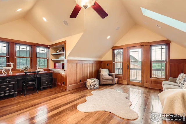 1570 County Road 37e, Lyons, CO 80540 - office space featuring lofted ceiling, wainscoting, light wood finished floors, a ceiling fan, and a skylight