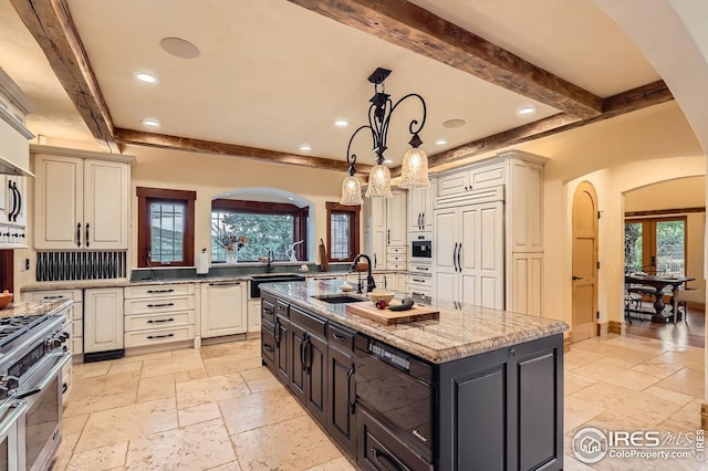 1570 County Road 37e, Lyons, CO 80540 - kitchen featuring stone tile floors, beam ceiling, high end stainless steel range oven, arched walkways, and recessed lighting