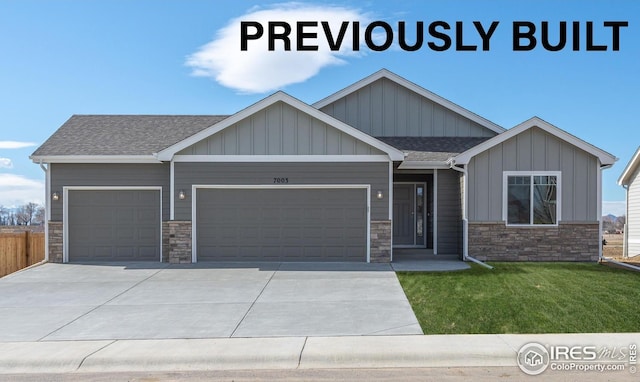 7150 Rye Grass Dr, Wellington, CO 80549 - craftsman-style house with a garage, stone siding, concrete driveway, and board and batten siding