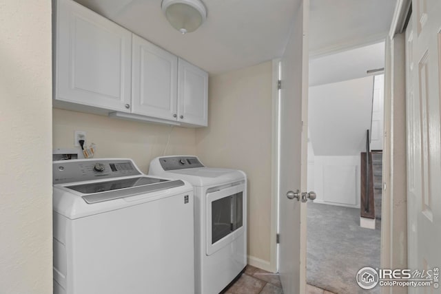 2037 Spencer St, Longmont, CO 80501 - washroom with washer and clothes dryer, cabinet space, and carpet flooring