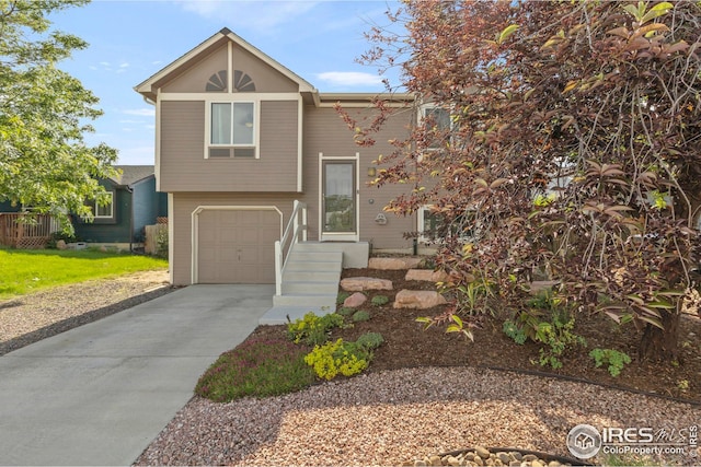 2037 Spencer St, Longmont, CO 80501 - view of front of house with driveway and an attached garage