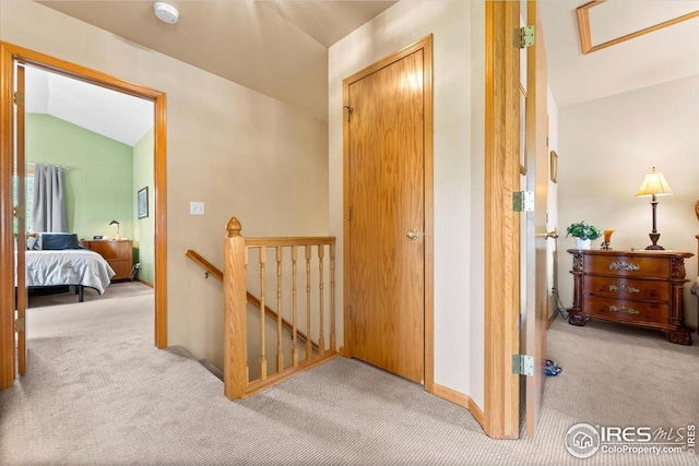 602 S 9th St, Berthoud, CO 80513 - corridor featuring carpet, an upstairs landing, and vaulted ceiling
