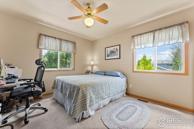602 S 9th St, Berthoud, CO 80513 - carpeted bedroom featuring an office area and ceiling fan
