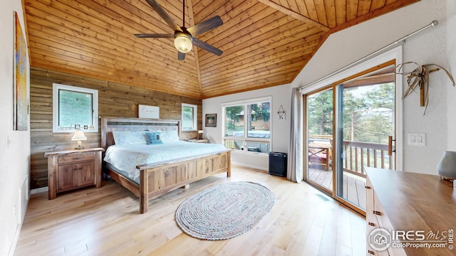 2029 Uplands Cir, Estes Park, CO 80517 - bedroom with access to outside, wooden walls, wooden ceiling, light wood finished floors, and vaulted ceiling