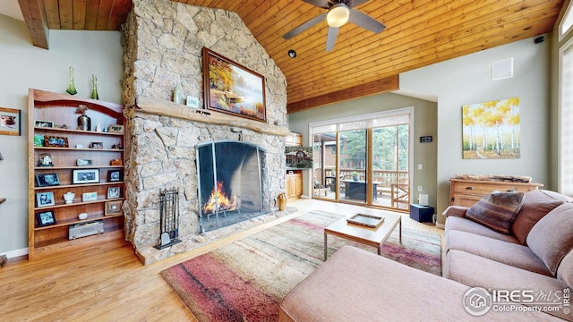 2029 Uplands Cir, Estes Park, CO 80517 - living area featuring wooden ceiling, wood finished floors, a ceiling fan, a stone fireplace, and vaulted ceiling