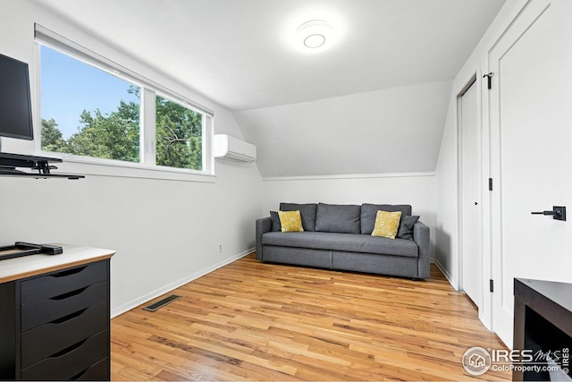 4545 Martin Dr, Boulder, CO 80305 - living area featuring an AC wall unit, light wood finished floors, and lofted ceiling