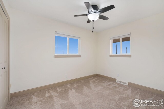 34288 County Road 59, Gill, CO 80624 - carpeted spare room featuring plenty of natural light and ceiling fan