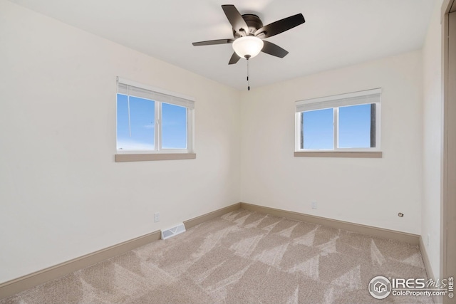 34288 County Road 59, Gill, CO 80624 - unfurnished room featuring light colored carpet, healthy amount of natural light, and a ceiling fan