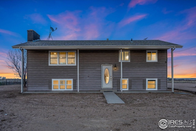 34288 County Road 59, Gill, CO 80624 - back of house with a chimney and roof with shingles