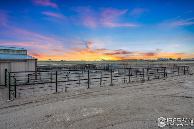 34288 County Road 59, Gill, CO 80624 - yard at dusk with an exterior structure, a view of rural / pastoral area, and an outbuilding