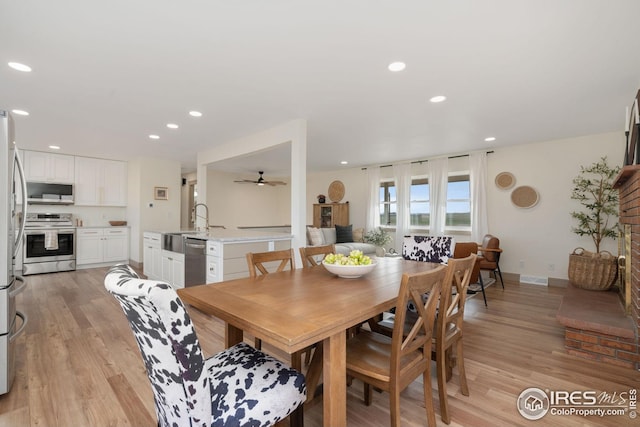 34288 County Road 59, Gill, CO 80624 - dining area with light wood-style flooring, a ceiling fan, and recessed lighting
