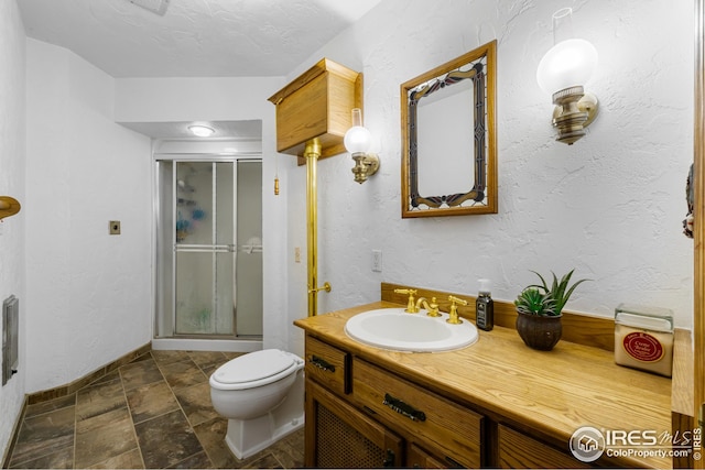 14975 US Highway 385, Julesburg, CO 80737 - full bathroom featuring a shower stall, vanity, and stone finish floors