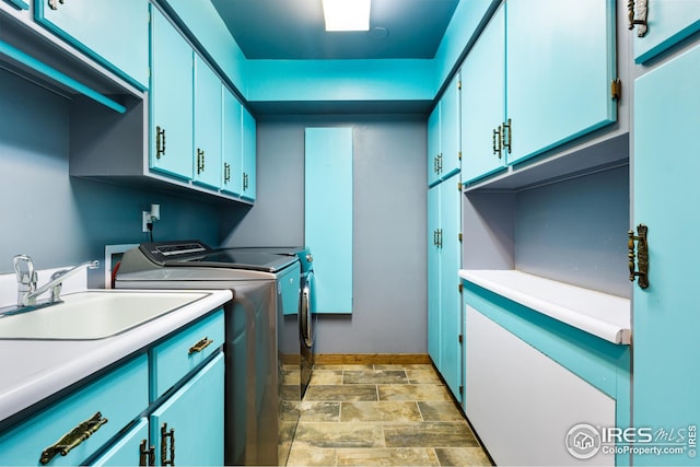 14975 US Highway 385, Julesburg, CO 80737 - laundry room with cabinet space, washer and dryer, and stone finish flooring