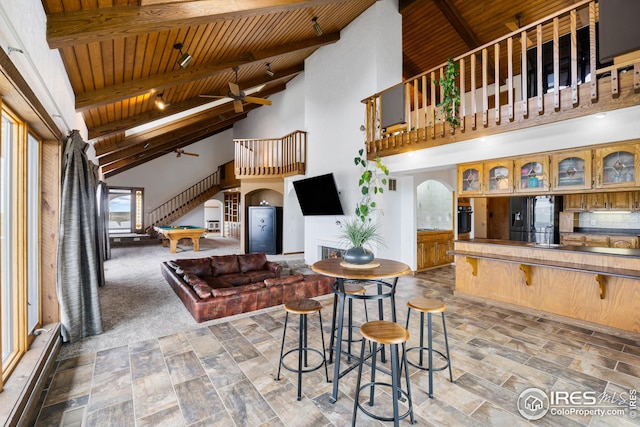 14975 US Highway 385, Julesburg, CO 80737 - living area with a wooden ceiling with exposed beams, arched walkways, high vaulted ceiling, billiards table, and a ceiling fan