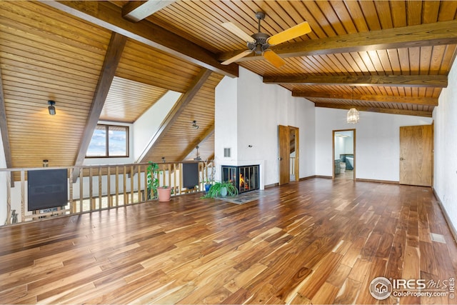 14975 US Highway 385, Julesburg, CO 80737 - unfurnished living room with a ceiling fan, wood-type flooring, a wood ceiling with exposed beams, a warm lit fireplace, and high vaulted ceiling