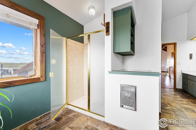 14975 US Highway 385, Julesburg, CO 80737 - full bath featuring vanity, a stall shower, heating unit, and vaulted ceiling