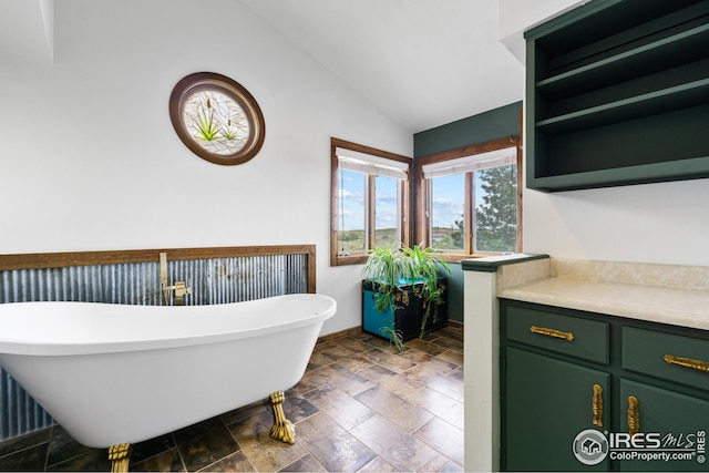 14975 US Highway 385, Julesburg, CO 80737 - full bathroom with a freestanding bath, lofted ceiling, and stone finish floors