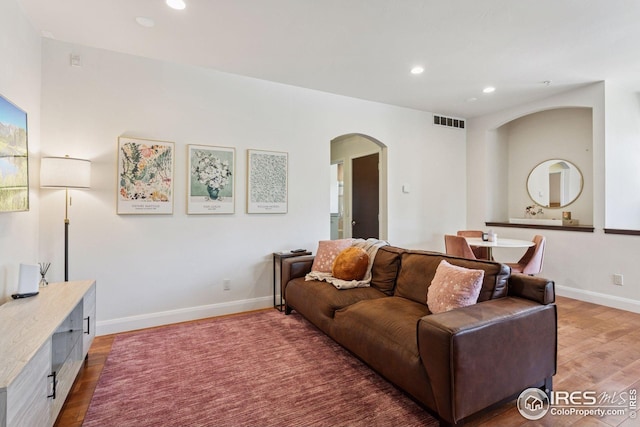 1944 Arapahoe Ave Unit A, Boulder, CO 80302 - living area featuring arched walkways, light wood-type flooring, and recessed lighting
